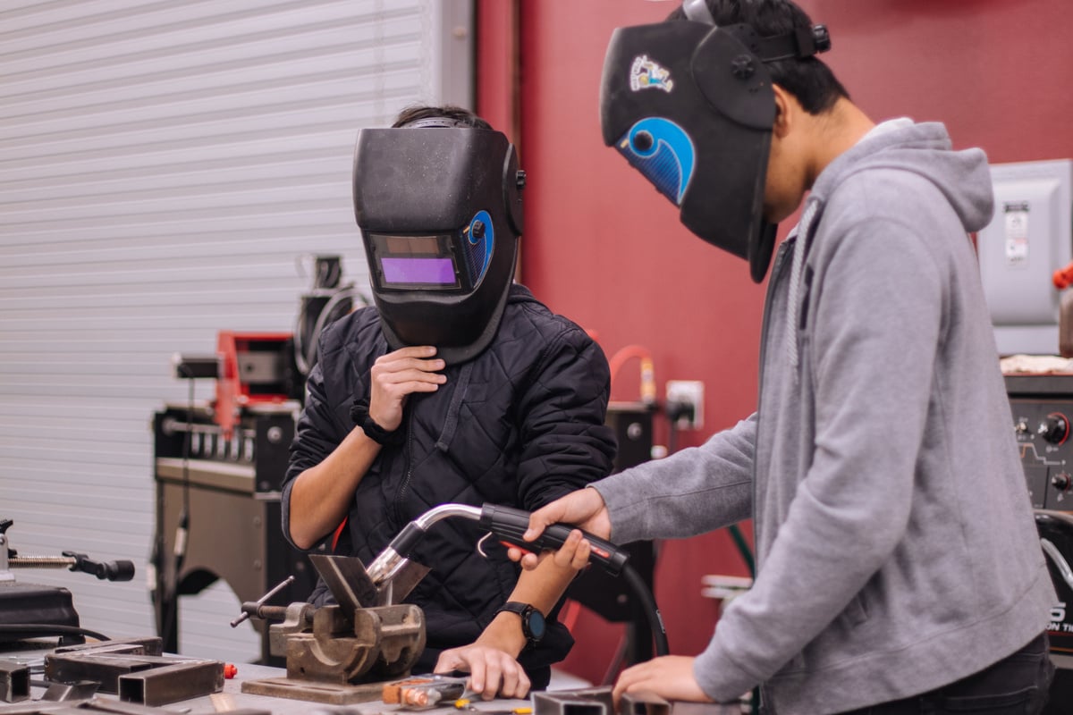 Students using a welding machine