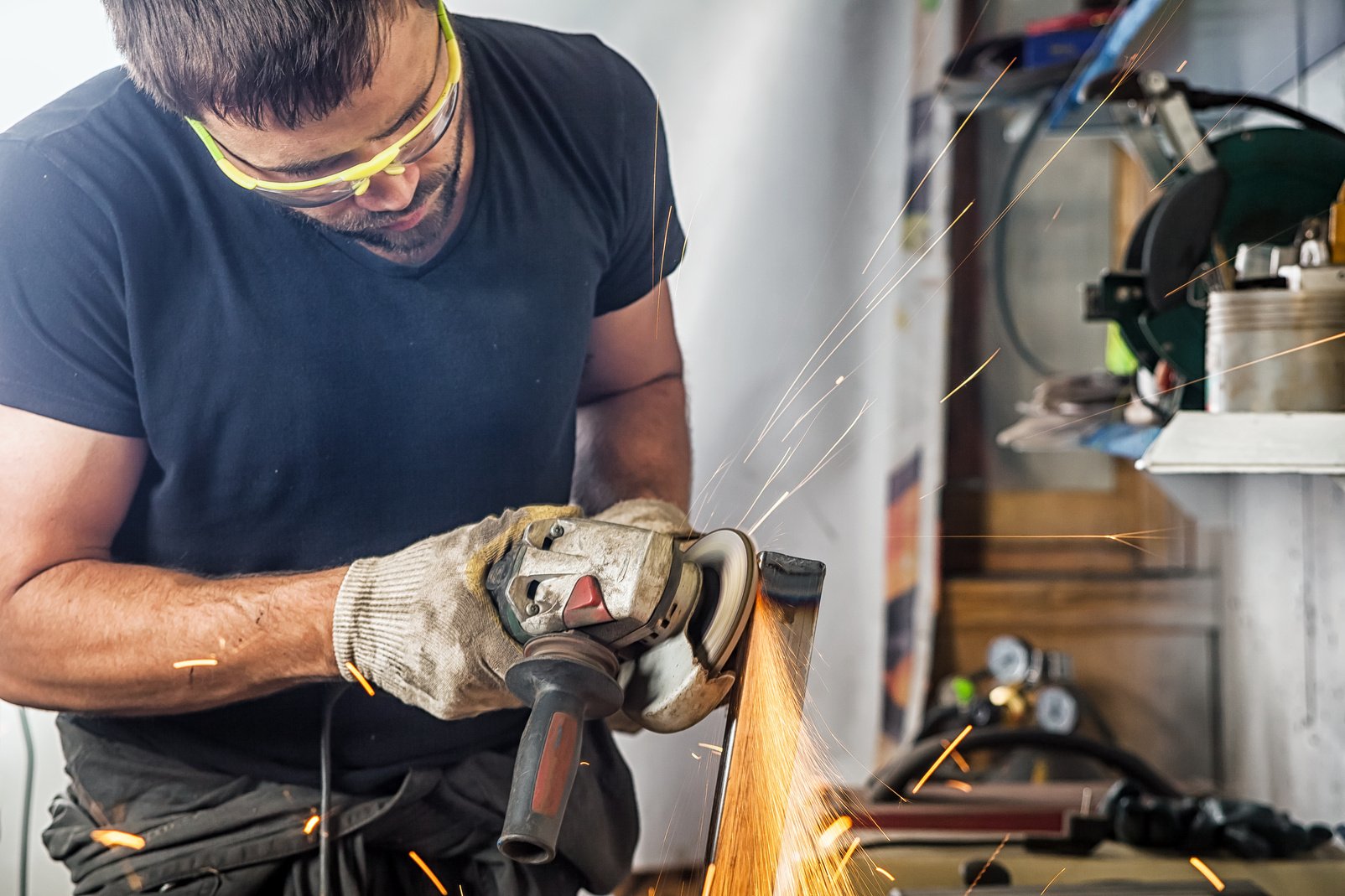 Man Grinder Metal an Angle Grinder