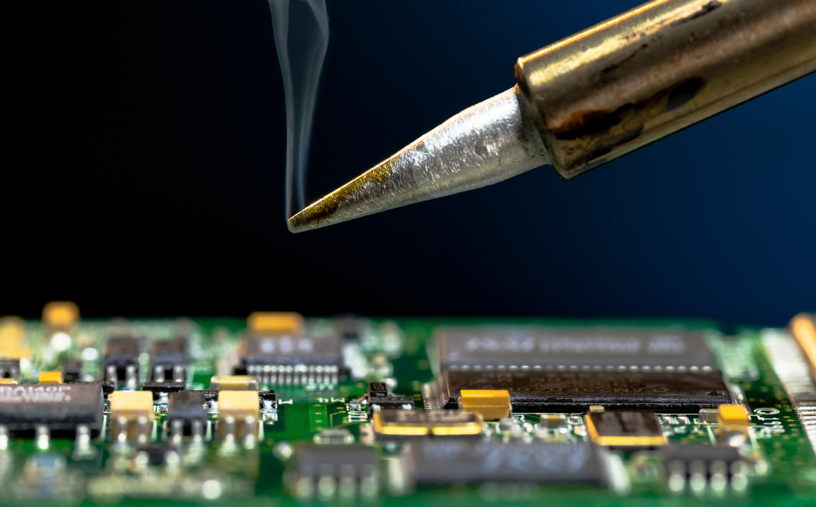 Soldering an electronic circuit board.